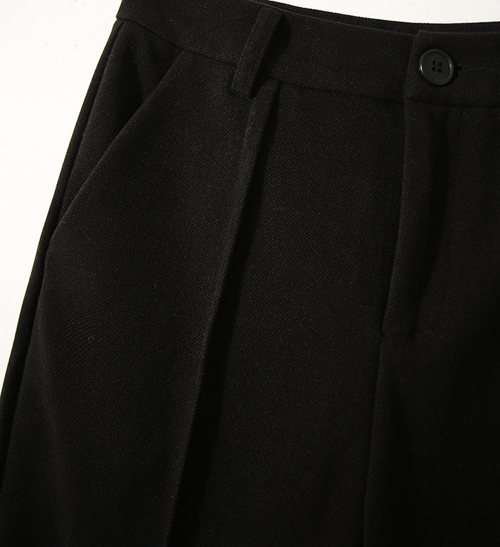 Women's wool tapered trousers by FJØRNA, made from Merino wool, featuring a comfortable, stylish tapered fit in neutral color.