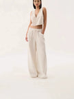Blue denim wide-leg drawstring women's jeans from FJØRNA, featuring a relaxed fit and casual style.