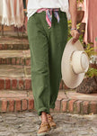 FJØRNA lightweight women's summer trousers with high waist, breathable fabric, and relaxed fit for warm-weather comfort.