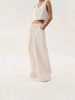 Blue denim wide-leg drawstring jeans for women by FJØRNA, relaxed fit pants with a casual, stylish look.