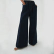 FJØRNA blue denim wide-leg drawstring women's jeans with relaxed fit and casual style, shown on a model.
