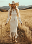White denim tassel maxi dress by FJØRNA featuring casual style, flowing fabric, and tassel details, perfect for relaxed occasions.