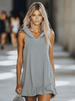 Grey sleeveless mini dress by FJØRNA, casual dress style, shown hanging with a simple design and lightweight fabric.