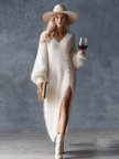 White knit V-neck midi dress for women by FJØRNA, featuring a fitted bodice and flowing skirt in soft knit fabric.