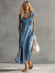 Blue denim V-neck midi dress by FJØRNA, casual style, featuring a relaxed fit and classic denim fabric.