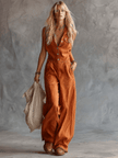 Rust orange cotton western-style sleeveless jumpsuit with V-neck, designed for women, by FJØRNA.