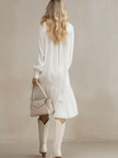 White denim ruffle midi dress by FJØRNA, featuring a stylish ruffle design and classic denim fabric, perfect for evening wear.