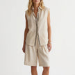 Off-white women's summer two-piece pleated co-ord set by FJØRNA, featuring lightweight fabric and matching top and skirt.
