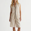 Off-white women's summer two-piece pleated co-ord set by FJØRNA, featuring lightweight fabric and matching top and skirt.
