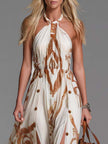 Off-White chiffon halter neck maxi dress by FJØRNA, featuring a flowy casual dress with elegant design and halter neckline.