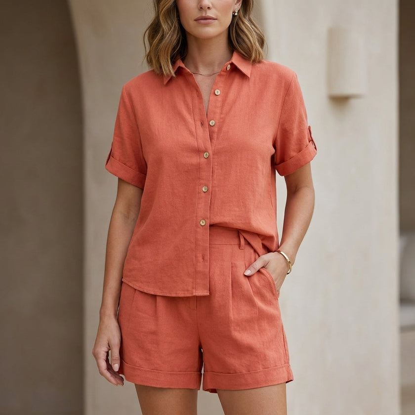 Orange FJØRNA women's two-piece co-ord set with button-front top and matching lightweight bottoms, casual and stylish for warm weather.
