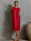 Orange linen sleeveless mini dress by FJØRNA, lightweight and stylish, perfect for summer or evening occasions.