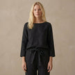 Elegant women's two-piece linen co-ord set with pockets from FJØRNA, featuring a stylish top and matching pants.