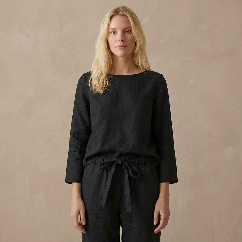 Elegant women's two-piece linen co-ord set with pockets from FJØRNA, featuring a stylish top and matching pants.