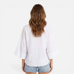 FJØRNA women's lightweight summer blouse, loose fit vacation shirt with relaxed style, shown in oversized fit on model.