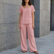 Pink women's summer two-piece co-ord set with wide-leg pants, relaxed fit, from FJØRNA, perfect for casual warm-weather wear.