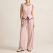 Pink women's summer two-piece co-ord set by FJØRNA with button-front top and matching shorts, casual and stylish for warm weather.