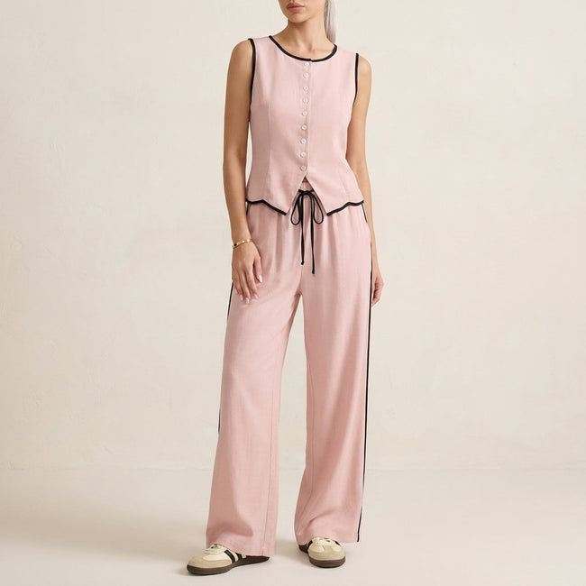Pink women's summer two-piece co-ord set by FJØRNA with button-front top and matching shorts, casual and stylish for warm weather.