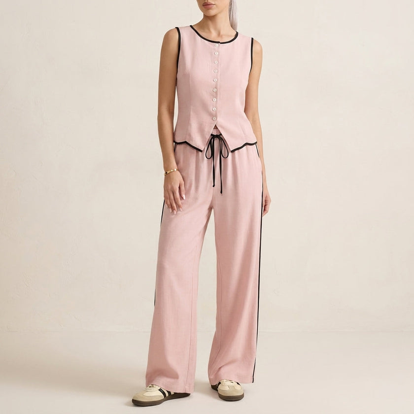Pink women's summer two-piece co-ord set by FJØRNA with button-front top and matching shorts, casual and stylish for warm weather.