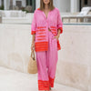 Pink FJØRNA women's summer two-piece set with geometric pockets and V-neck, featuring a stylish, comfortable co-ord outfit.