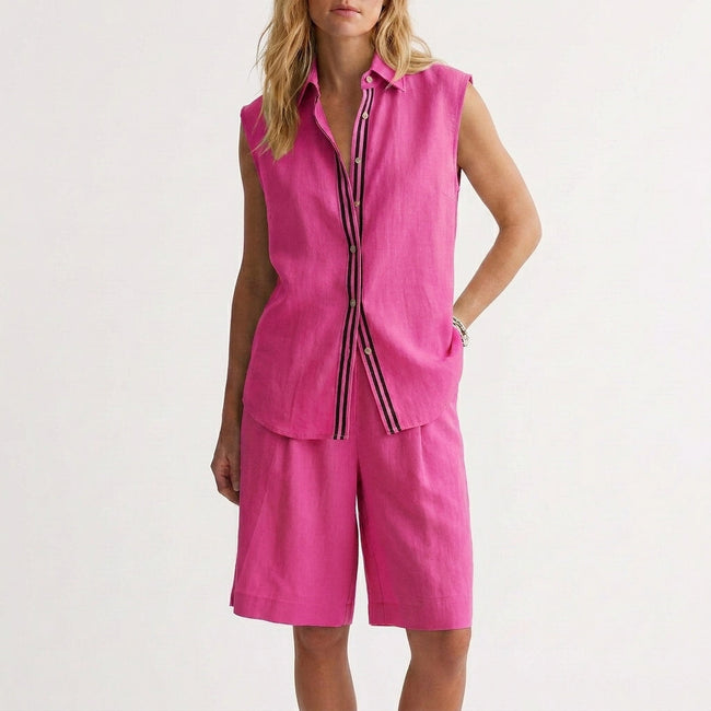 Pink women's summer two-piece pleated co-ord set by FJØRNA, lightweight matching top and skirt ensemble.
