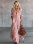 Pink linen V-neck maxi dress by FJØRNA, casual style with flowing fabric and relaxed fit, shown on a model.
