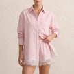 Pink and white lace two-piece women's co-ord set by FJØRNA, featuring elegant design and coordinated top and skirt.