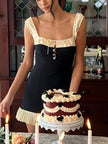 FJØRNA women's mini dress with pleated hem, suitable for party and day wear, shown in a stylish, flowy design.