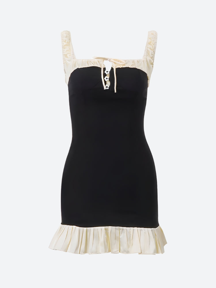 FJØRNA women's mini dress with pleated hem, perfect for party and daytime occasions, showcasing a stylish and feminine design.