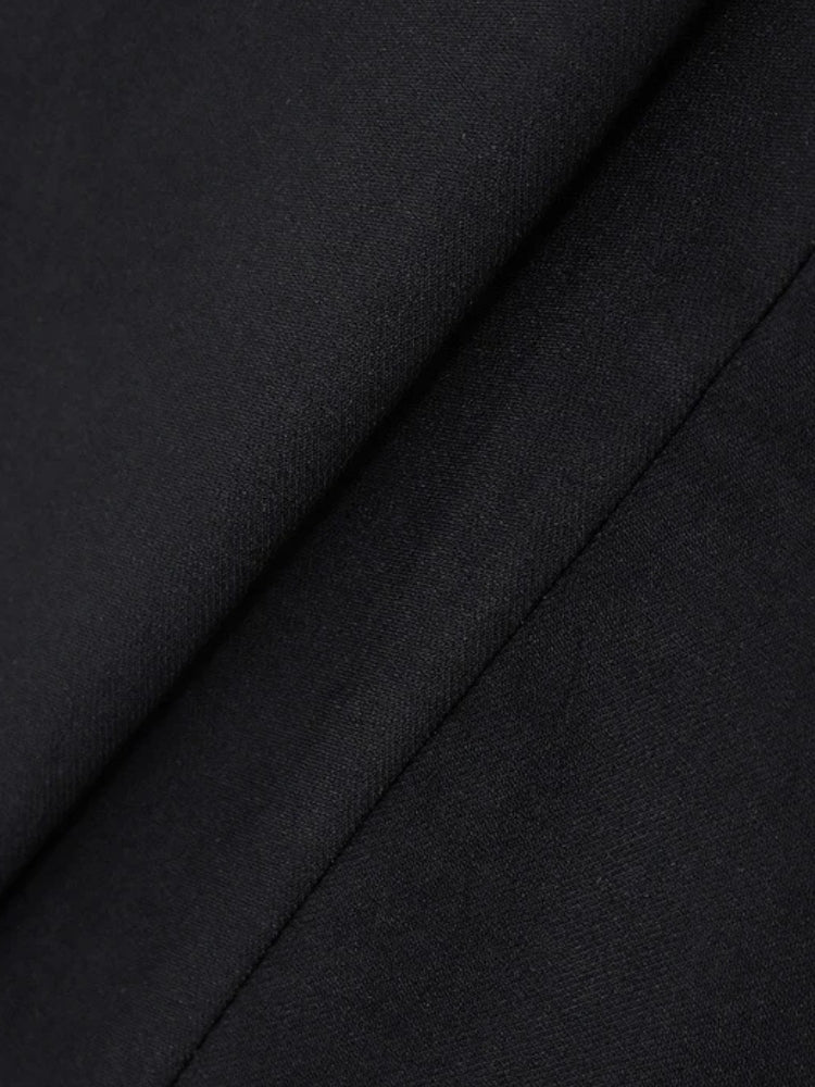 FJØRNA women's mini dress with pleated hem, suitable for party and day wear, showcasing its stylish and flowy design.