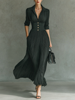 FJØRNA women's pleated maxi dress with flowing fabric and elegant design, perfect for formal or casual occasions.