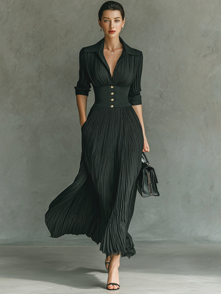 FJØRNA women's pleated maxi dress with flowing fabric, V-neckline, and wide shoulder straps, styled for elegant occasions.