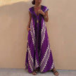 Purple FJØRNA women's elegant maxi dress with geometric V-neck, flowing fabric, and sleeveless design for a stylish look.