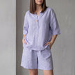 Purple FJØRNA women's two-piece co-ord set with pockets, V-neck top and lightweight fabric, perfect for stylish casual wear.