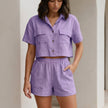Purple women's summer two-piece co-ord set by FJØRNA featuring a button-front top and matching shorts.