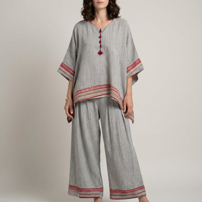 Red and white striped women's summer two-piece co-ord set with wide-leg pants by FJØRNA, ideal for casual warm-weather outfits.