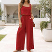Red women's summer two-piece linen co-ord set by FJØRNA with pockets, featuring a stylish crop top and matching high-waisted shorts.