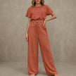 Red summer two-piece women's co-ord set by FJØRNA featuring a drawstring design and lightweight fabric.