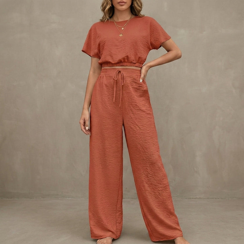 Red summer two-piece women's co-ord set by FJØRNA featuring a drawstring design and lightweight fabric.