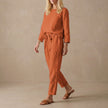 Red FJØRNA women's two-piece linen co-ord set with stylish pockets, perfect for casual or elegant summer wear.