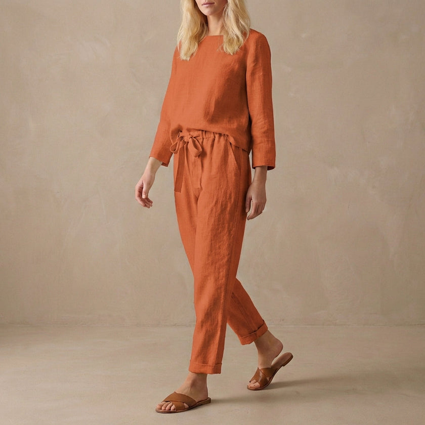 Red FJØRNA women's two-piece linen co-ord set with stylish pockets, perfect for casual or elegant summer wear.