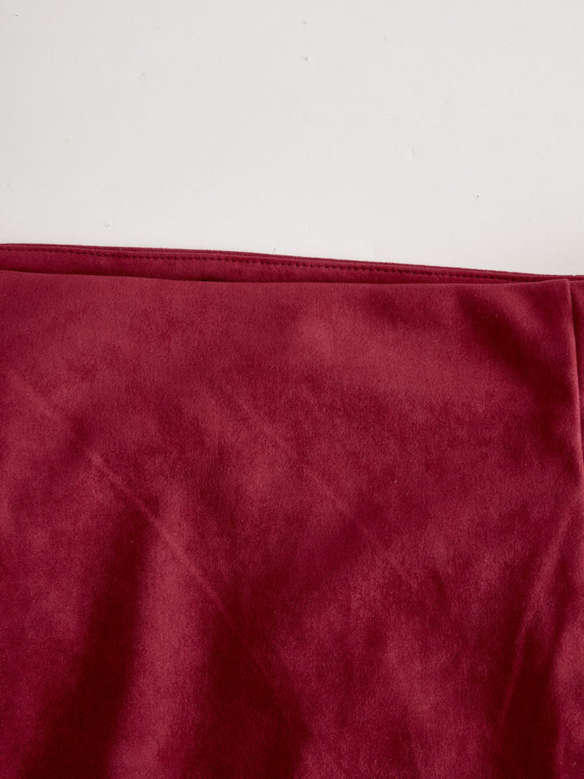Red faux suede slit midi dress by FJØRNA, casual dress style, shown on a model with a fitted silhouette and slit detail