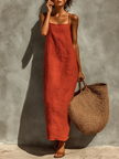 Red linen casual dress by FJØRNA, featuring a relaxed fit with short sleeves and a flowing silhouette, perfect for warm weather.