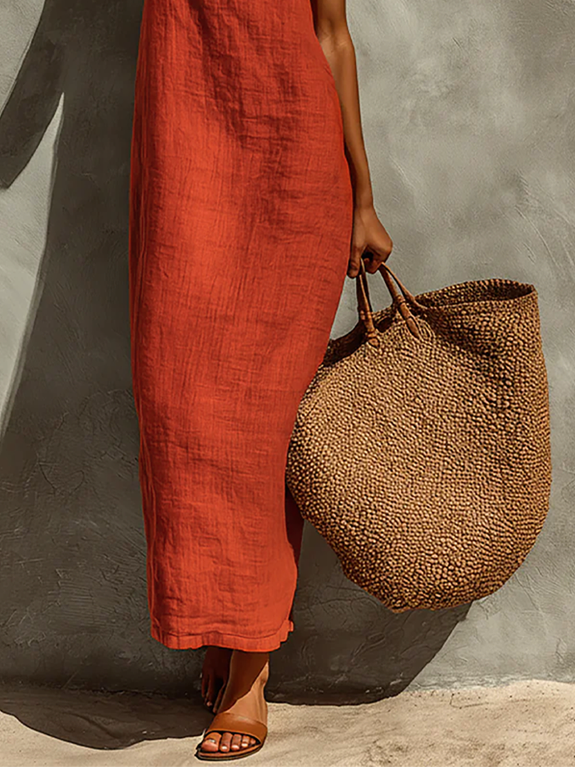 Red linen casual dress by FJØRNA, featuring a relaxed fit, sleeveless design, and knee-length silhouette.
