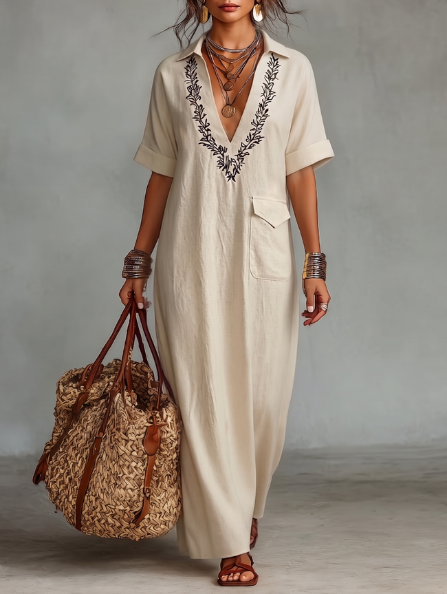 Red linen embroidered maxi dress for women by FJØRNA, flowing design with intricate embroidery details.