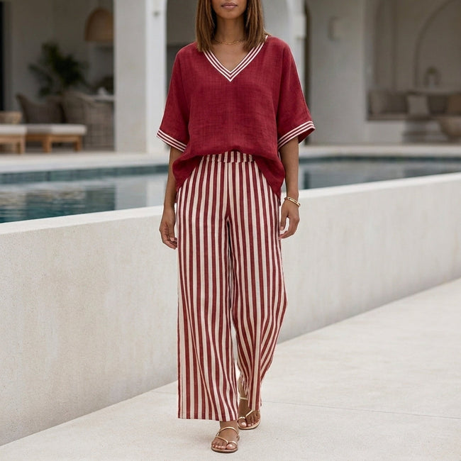 Red FJØRNA summer two-piece women's co-ord set with striped high-waist design, featuring a crop top and matching skirt.