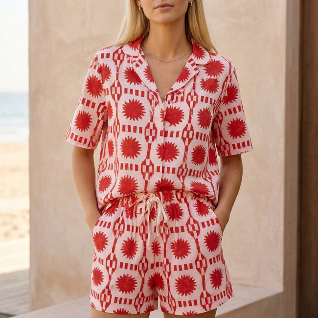 Red geometric high waist two-piece women's co-ord set by FJØRNA featuring a stylish, coordinated top and pants ensemble.