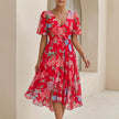 Red FJØRNA women's elegant midi dress with V-neck, short sleeves, and wrap design, perfect for stylish occasions.
