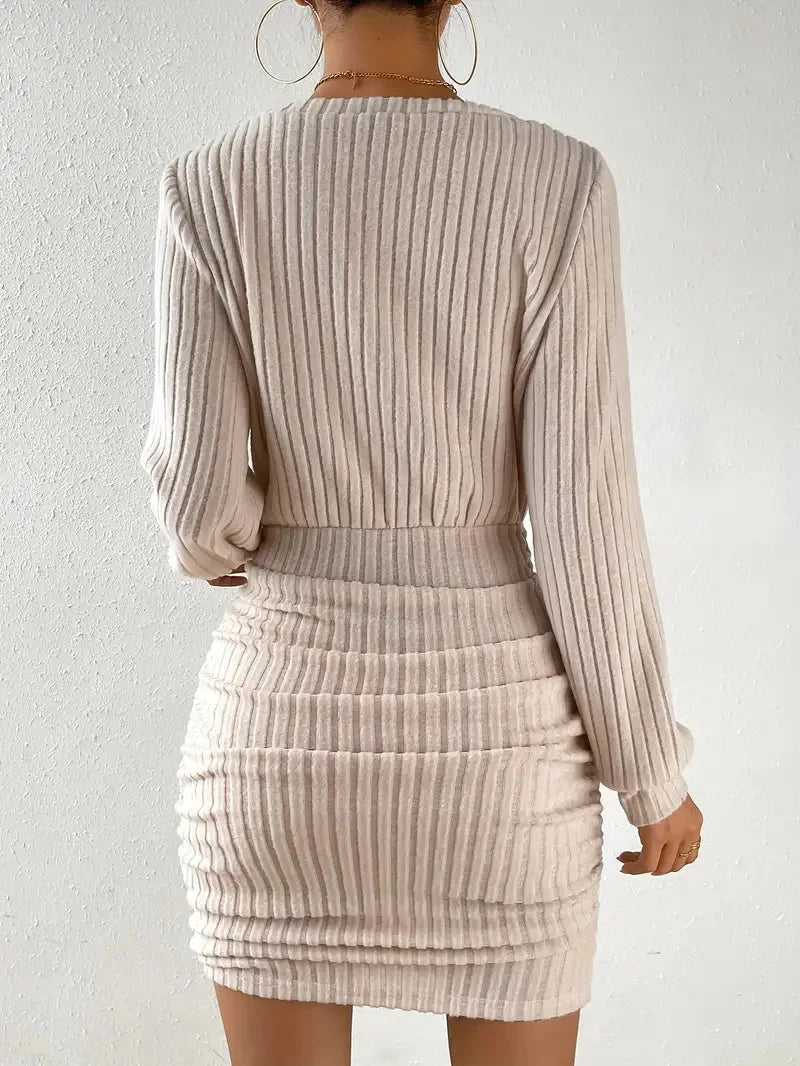 FJØRNA ribbed knit women's mini dress featuring a fitted style, perfect for party or daytime wear, shown in a close-up image.