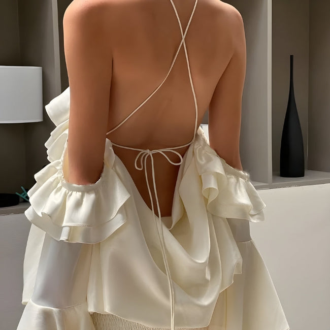 FJØRNA rose ruffled mini dress with layered ruffle details, perfect for party or daytime wear, shown on a model.